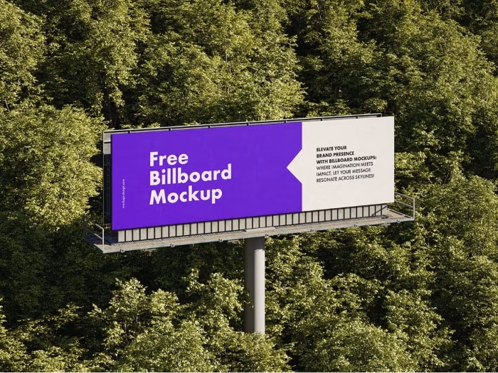 Billboard pomiędzy drzewami.