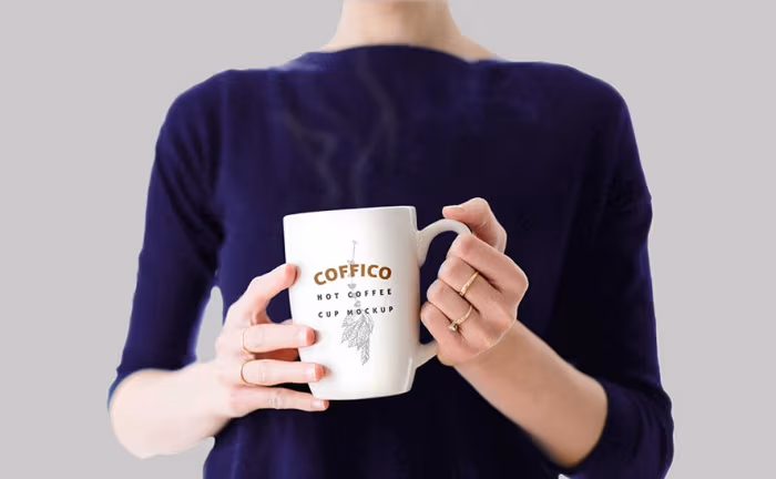 woman-holding-coffee-mug-mockup-psd